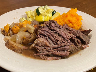 Buffalo Roast with sweet potatoes and vegetables.